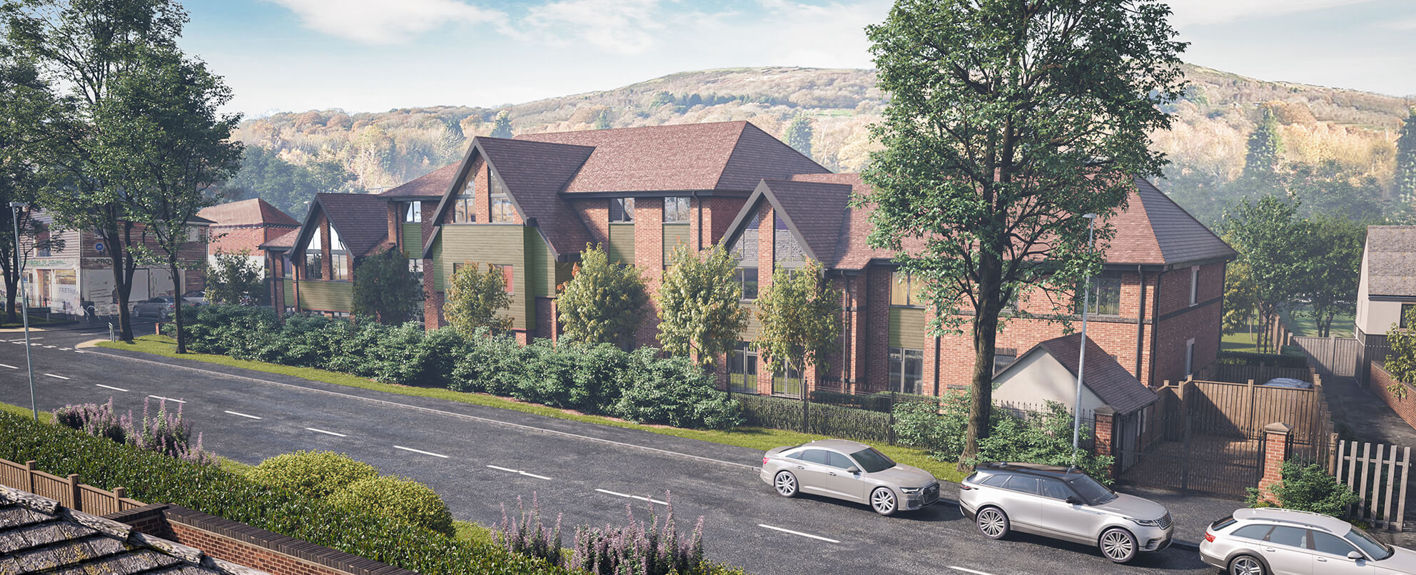 Architectural illustration of a modern brick building with a sloped roof, surrounded by lush greenery, parked cars in the foreground, and hills in the background under a clear sky